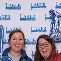 Two ladies posing together